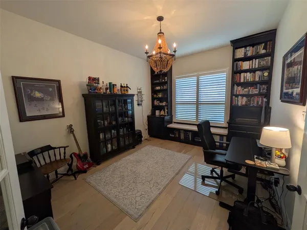 a bathroom with a granite countertop sink and a toilet