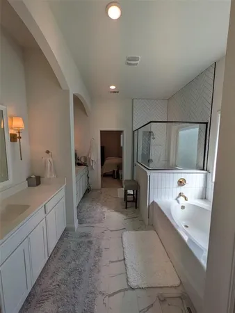 a bedroom with bed and window