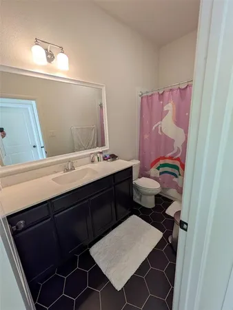 a utility room with sink dryer and washer