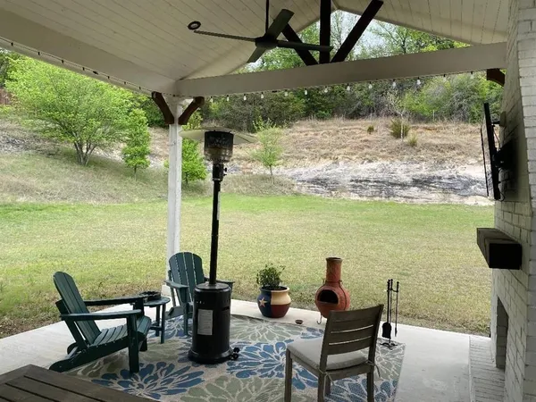 a view of a balcony with a table and chairs