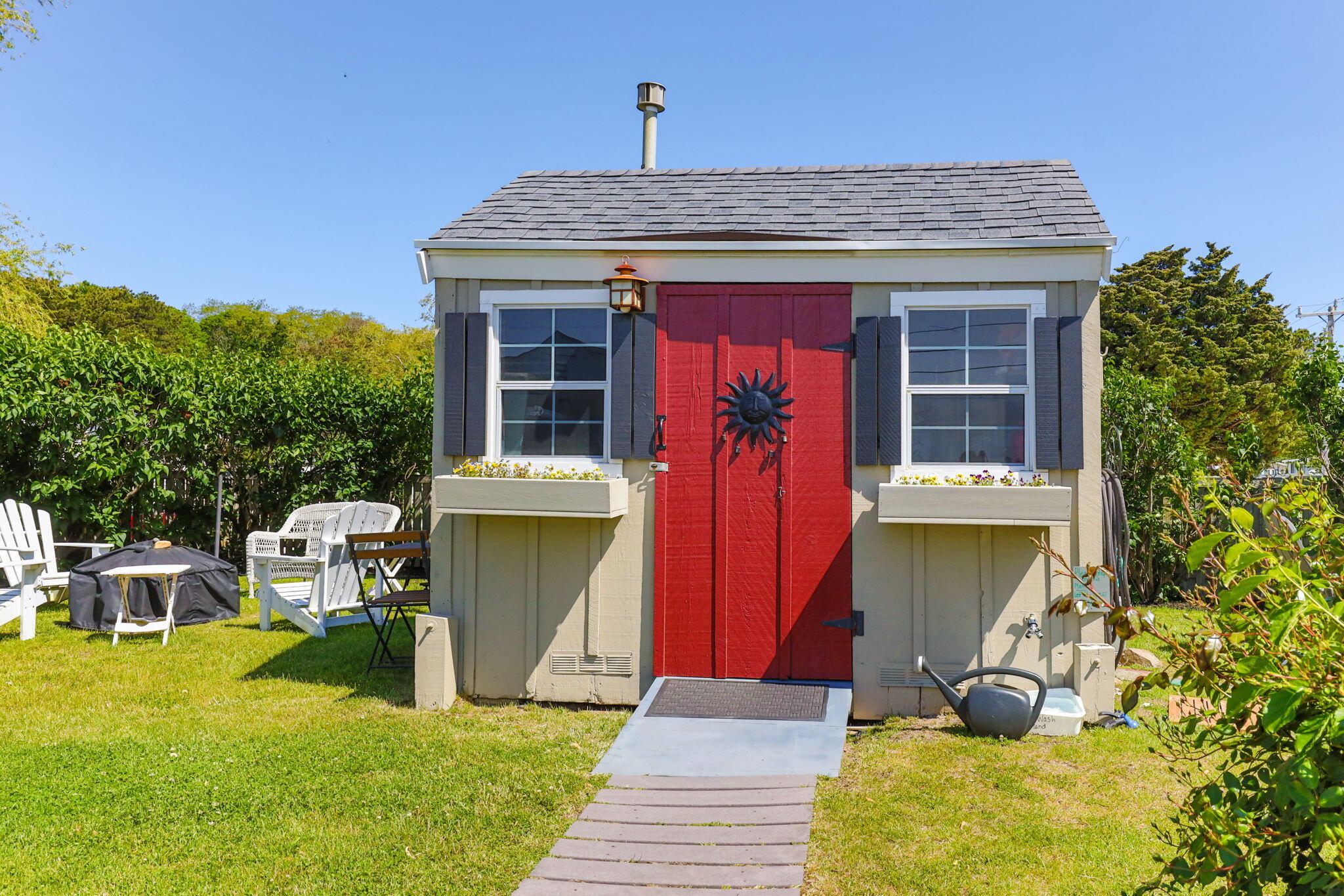 164 Kendrick Avenue, Unit C Wellfleet, MA 02667 - Photo 18 of 27 a front view of a house with garden