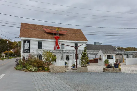 a front view of a house with a sitting area