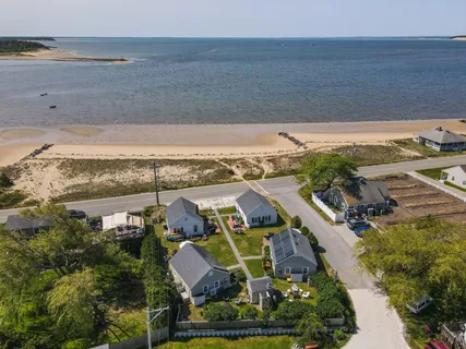 an aerial view of a house with a ocean view