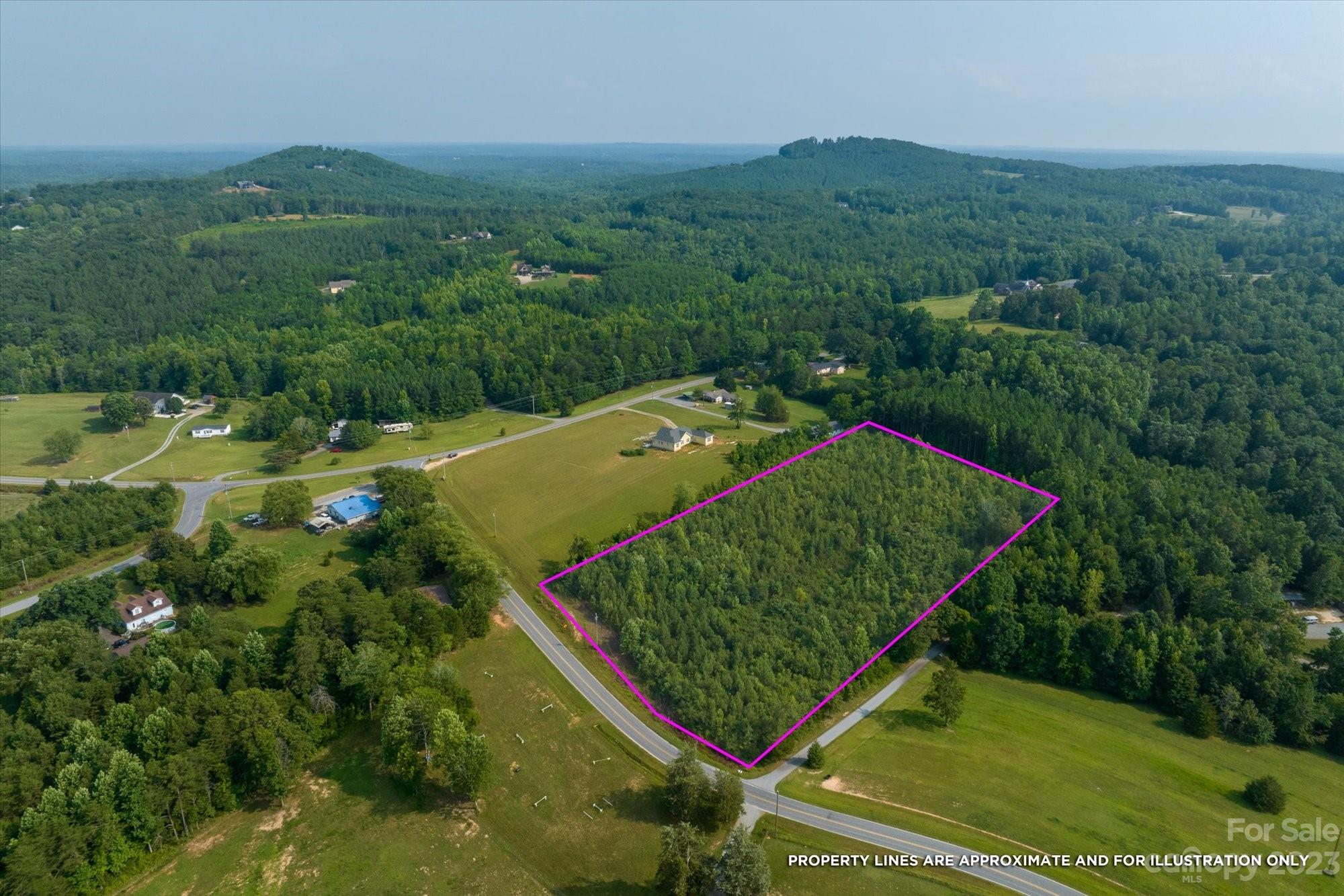 0 Bill Collins Road Tryon, NC 28782 - Photo 2 of 11 an aerial view of a residential houses with outdoor space and trees all around