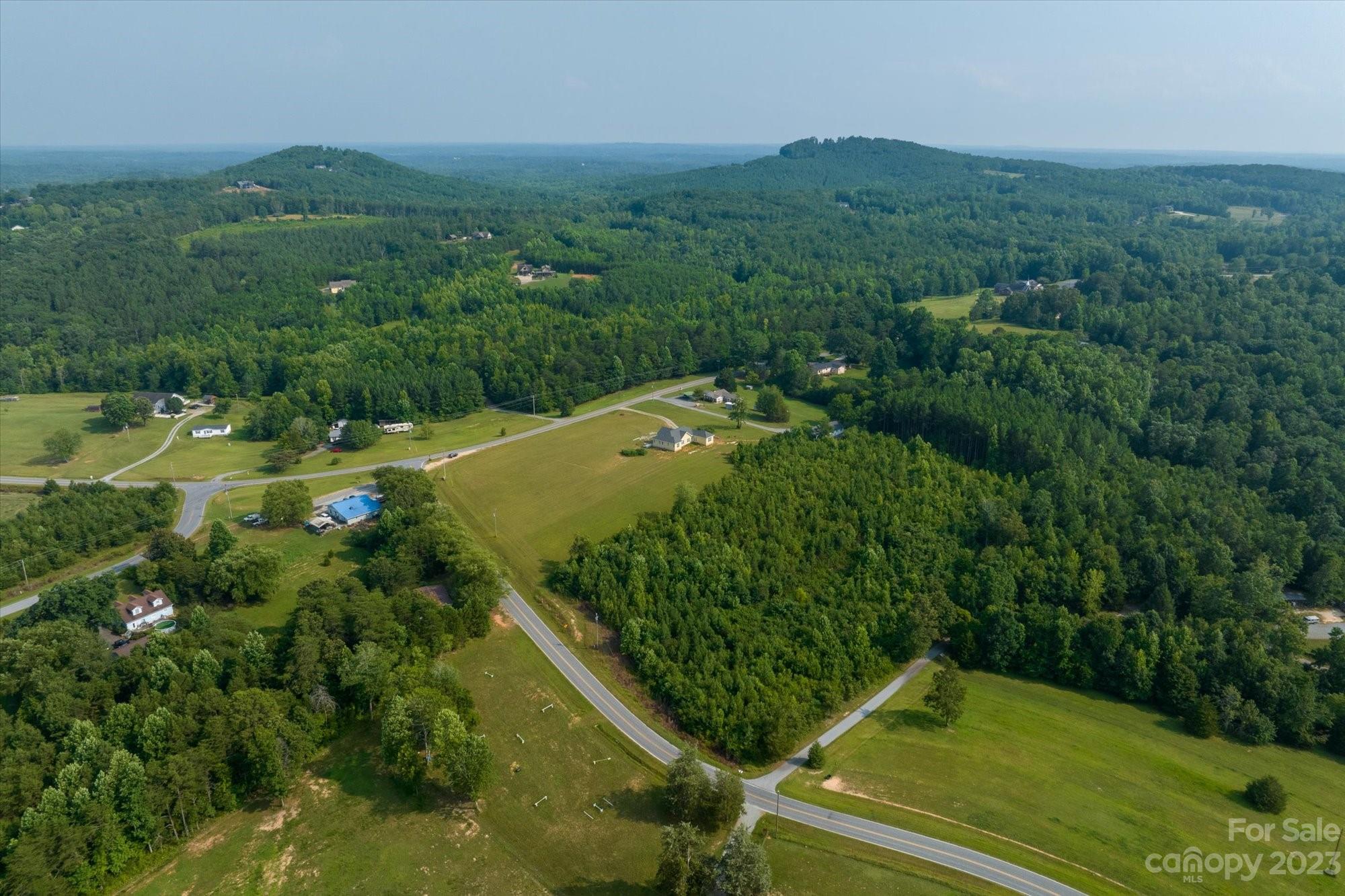 0 Bill Collins Road Tryon, NC 28782 - Photo 9 of 11 an aerial view of residential houses with outdoor space and trees
