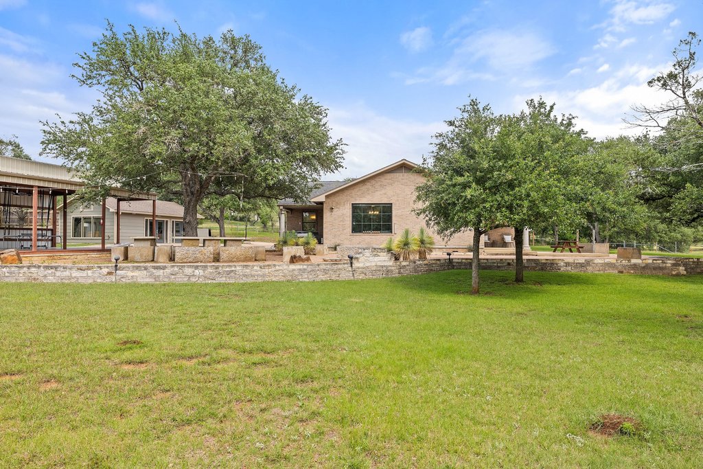 12135 Fitzhugh Road Austin, TX 78736 - Photo 26 of 30 a front view of a house with garden