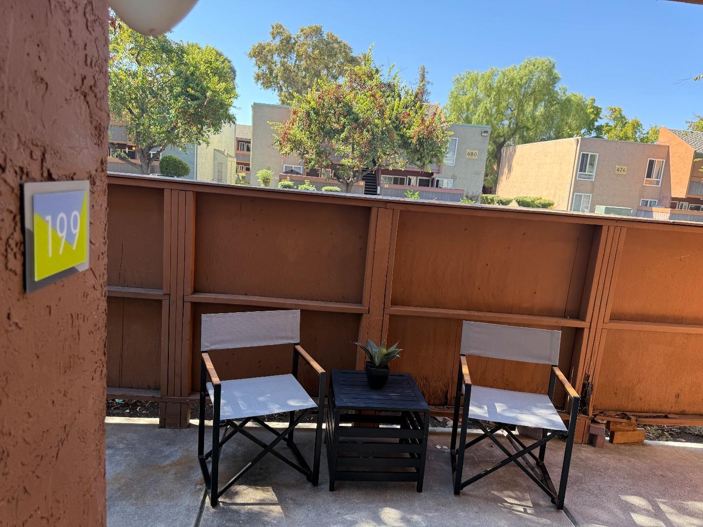 496 Dempsey Road, Unit 199 Milpitas, CA 95035 - Photo 26 of 41 a balcony with table and chairs