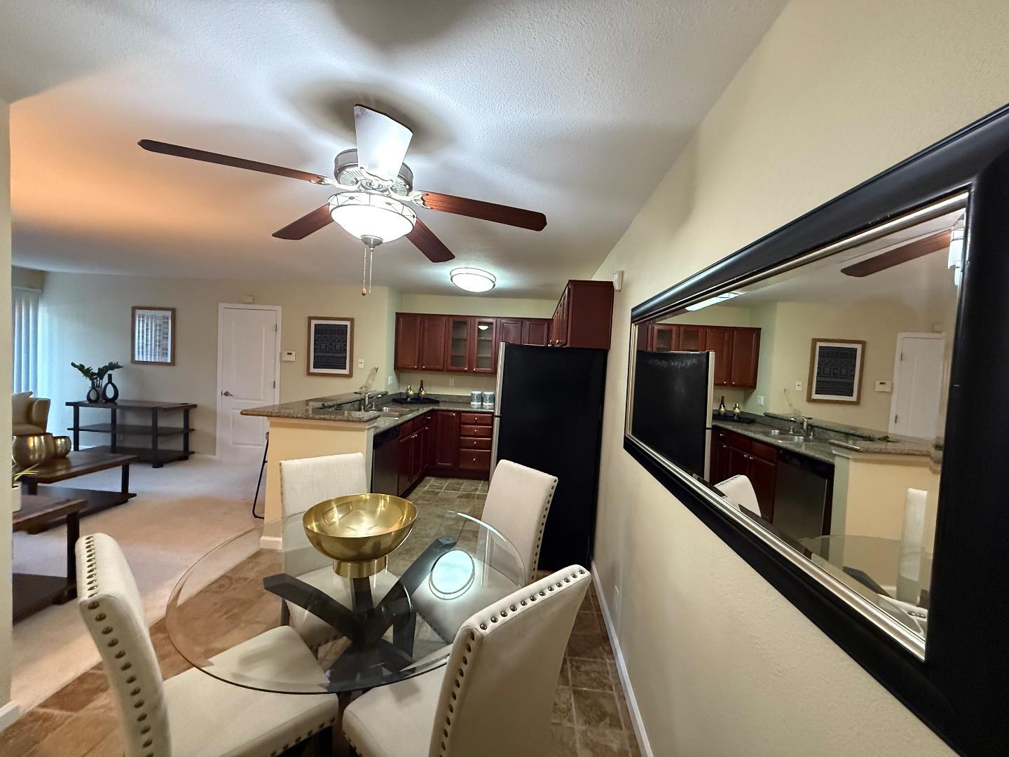 496 Dempsey Road, Unit 199 Milpitas, CA 95035 - Photo 8 of 41 a view of a dining room with furniture and a chandelier