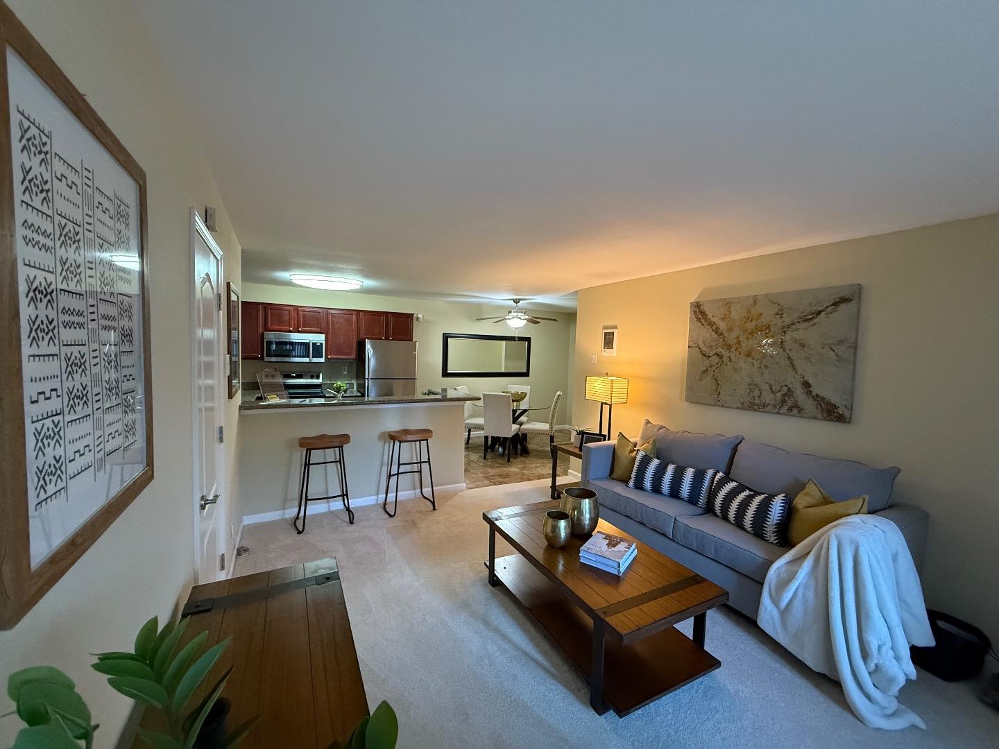 496 Dempsey Road, Unit 199 Milpitas, CA 95035 - Photo 10 of 41 a living room with furniture and a flat screen tv