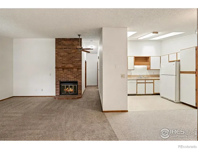 a kitchen with stainless steel appliances granite countertop a refrigerator sink stove microwave and cabinets