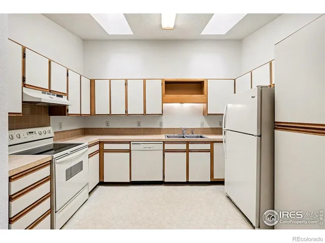 a view of an empty room and closet area