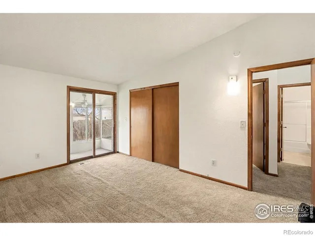 a bathroom with a sink a toilet a mirror and shower