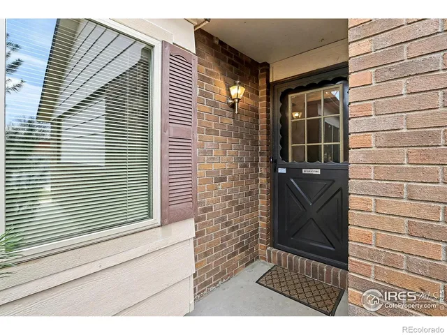 a view of an empty room and wooden floor