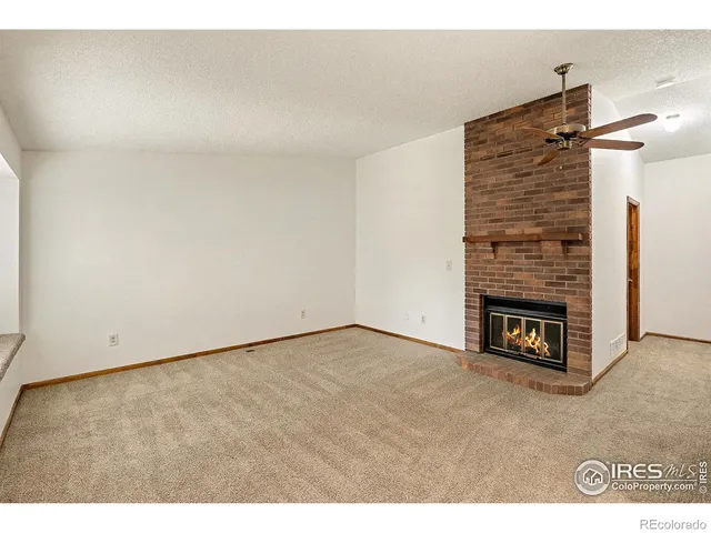 a kitchen that has a lot of white cabinets