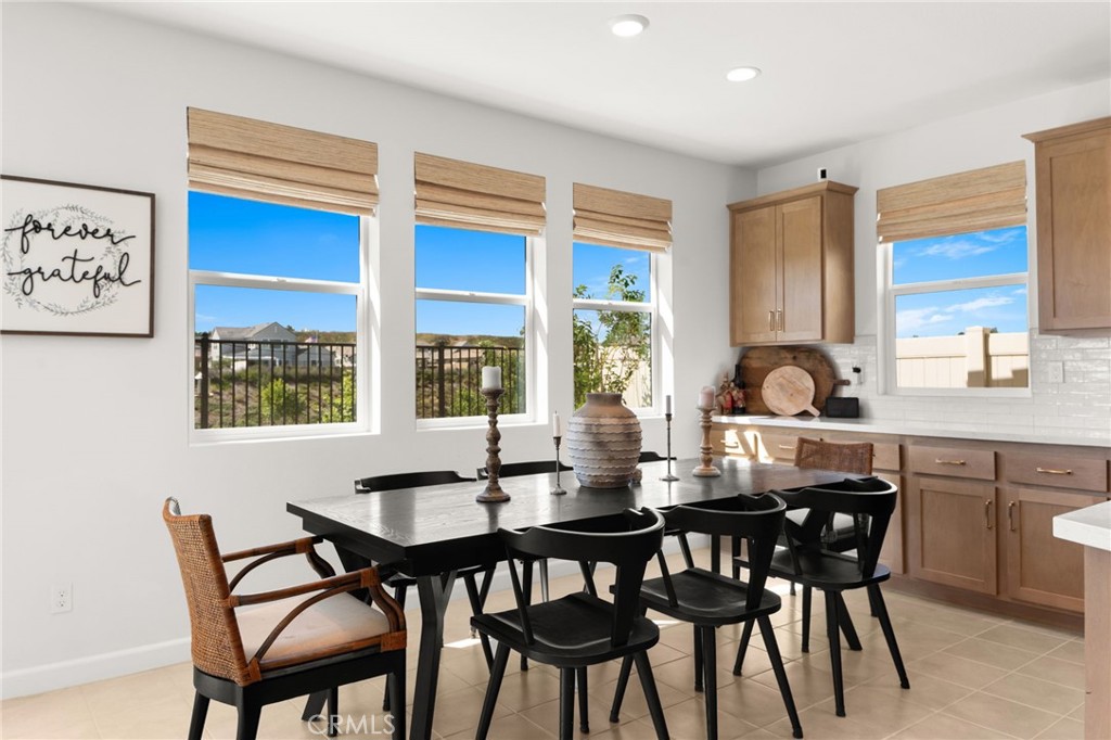 32259 Hillstone Street Temecula, CA 92591 - Photo 13 of 62 a view of a dining room and chairs