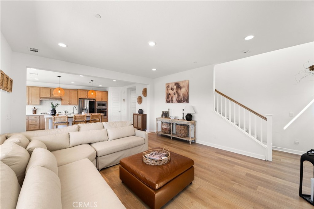32259 Hillstone Street Temecula, CA 92591 - Photo 19 of 62 a living room with furniture and a wooden floor