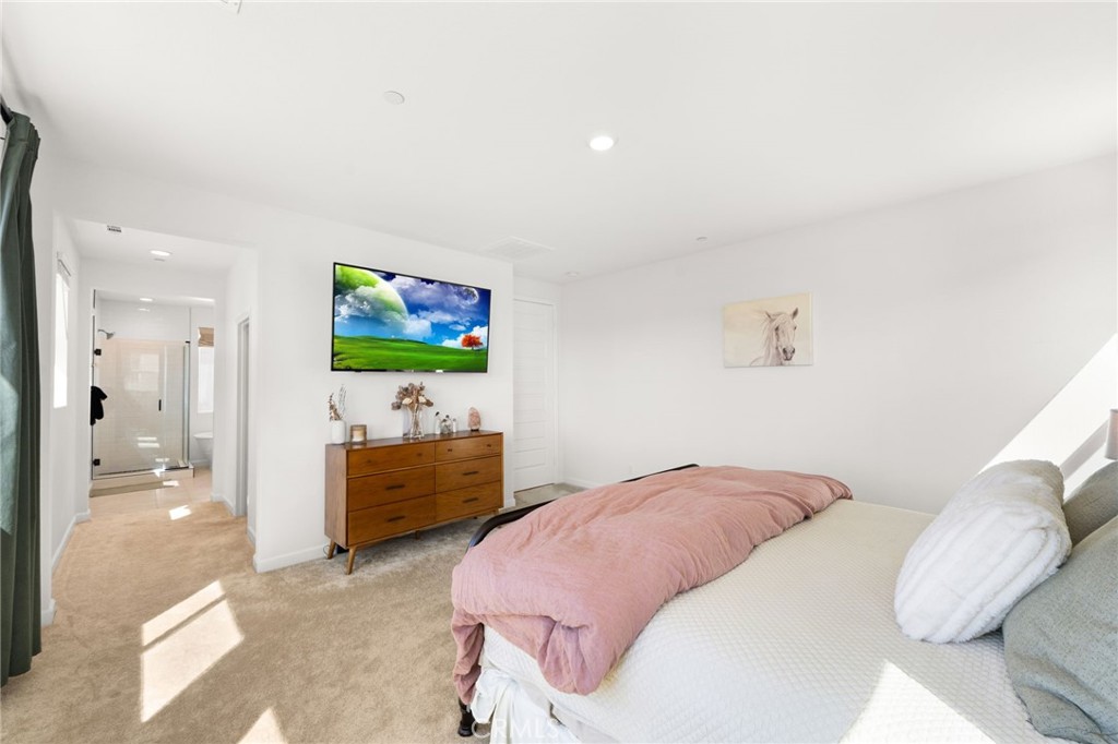 32259 Hillstone Street Temecula, CA 92591 - Photo 23 of 62 a bedroom with a bed and a flat screen tv