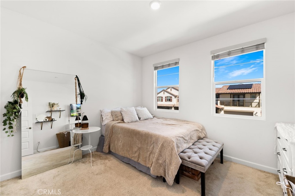 32259 Hillstone Street Temecula, CA 92591 - Photo 30 of 62 a bedroom with a bed and a couch