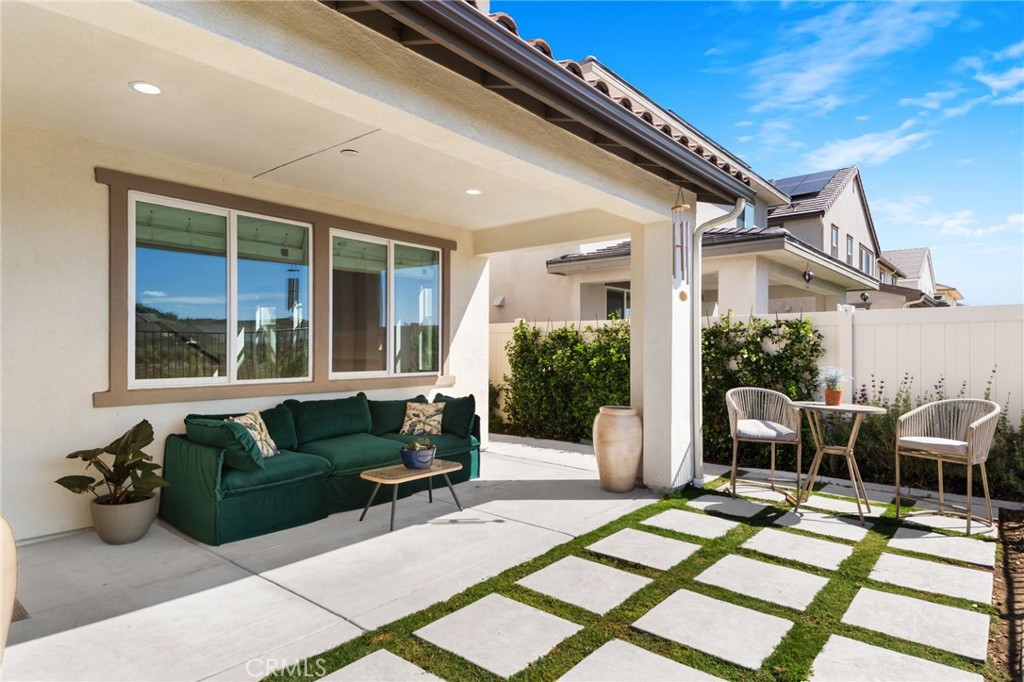 32259 Hillstone Street Temecula, CA 92591 - Photo 34 of 62 a view of a patio with couches chairs and potted plants