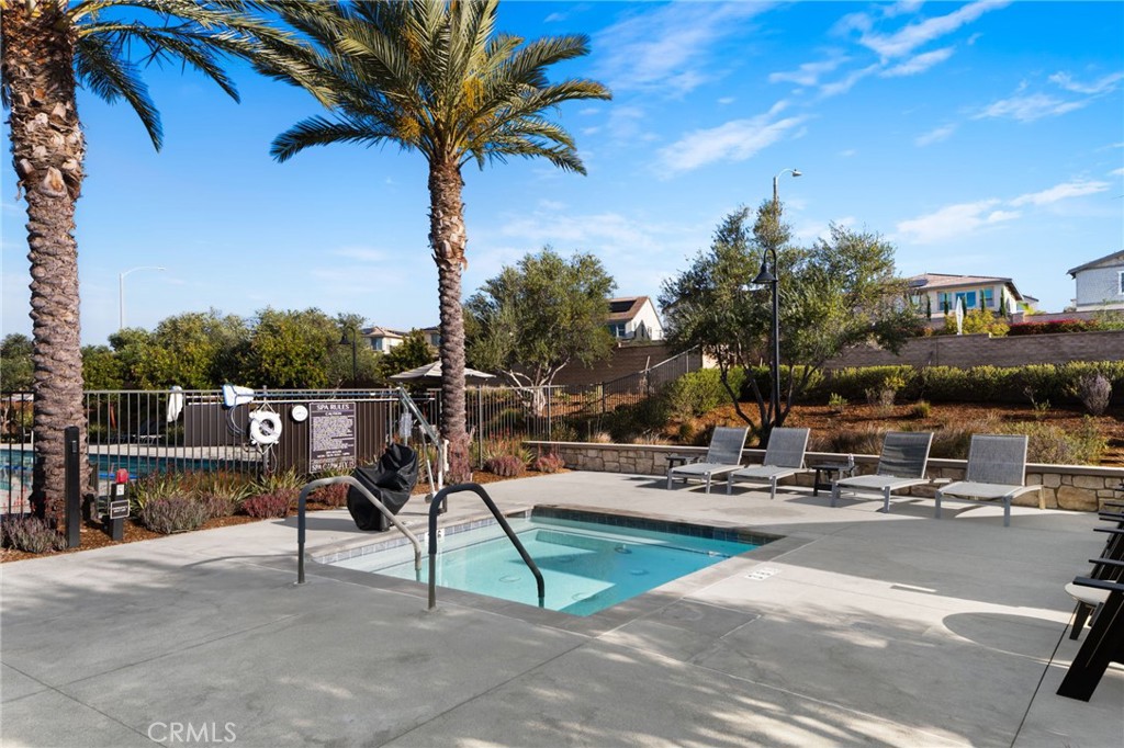 32259 Hillstone Street Temecula, CA 92591 - Photo 47 of 62 a view of a park with swings and slides