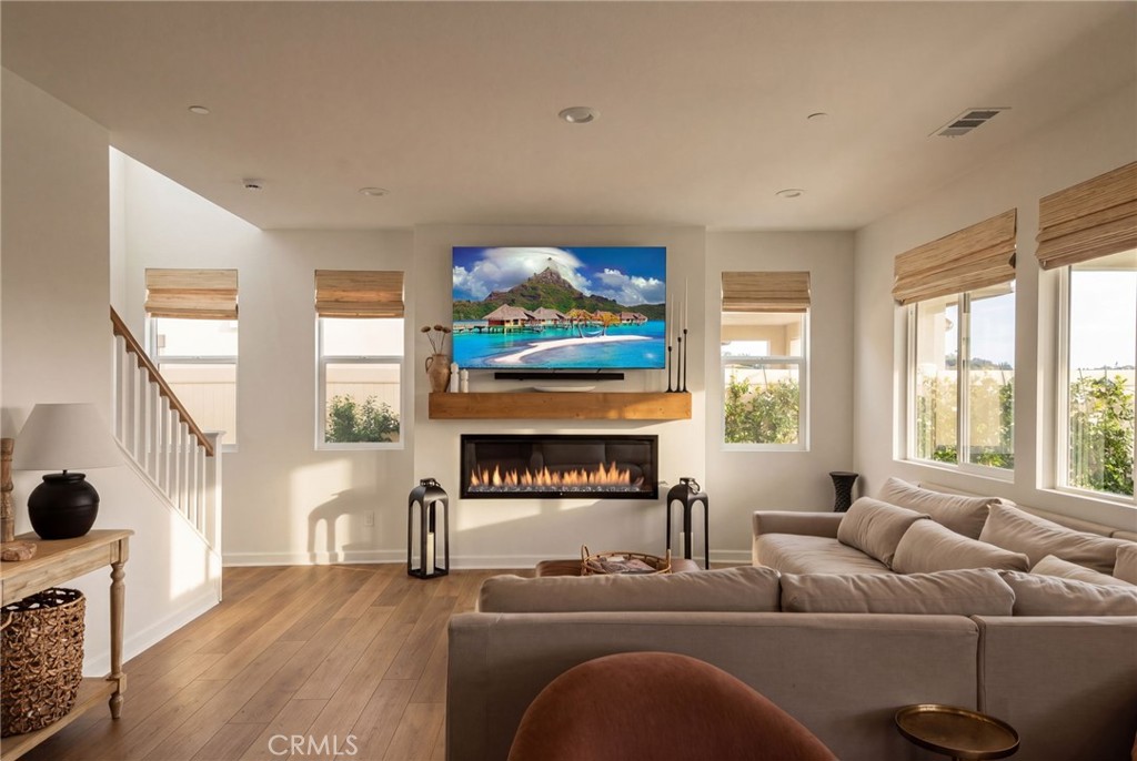 32259 Hillstone Street Temecula, CA 92591 - Photo 5 of 62 a living room with furniture a fireplace and a large window