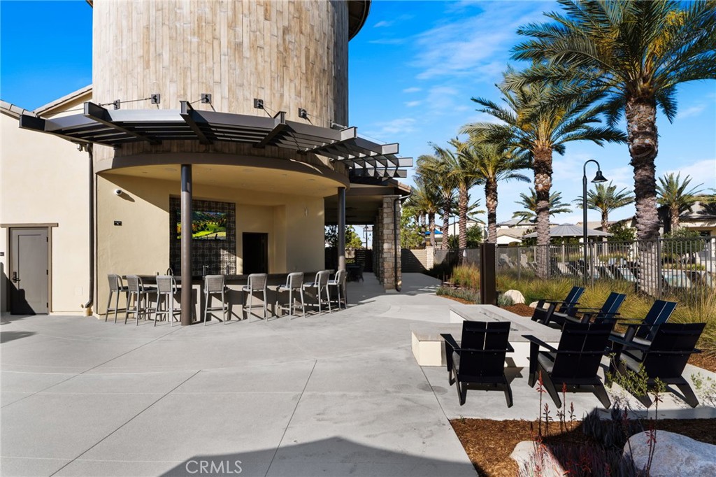 32259 Hillstone Street Temecula, CA 92591 - Photo 51 of 62 a view of a patio with table and chairs and potted plants