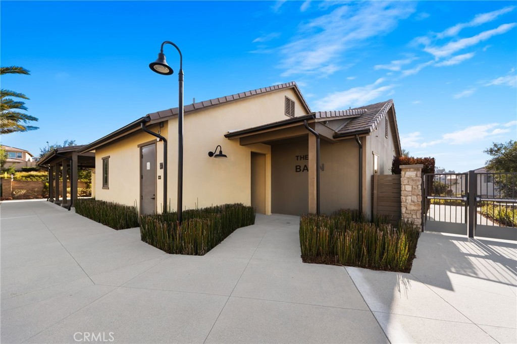 32259 Hillstone Street Temecula, CA 92591 - Photo 52 of 62 a front view of a house with a garden