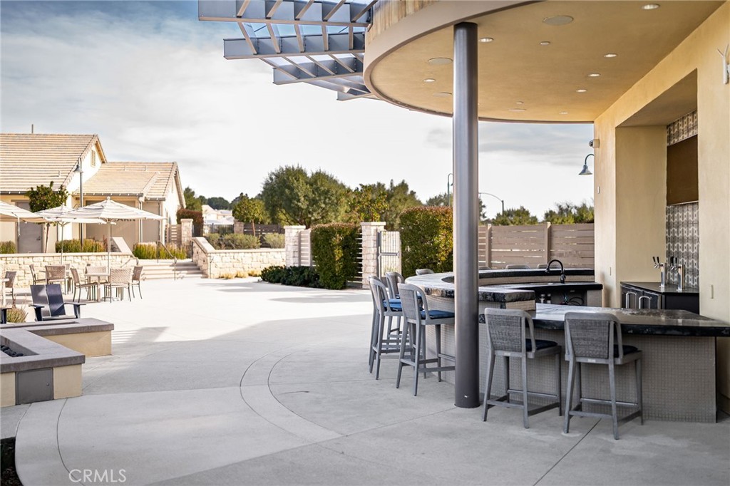 32259 Hillstone Street Temecula, CA 92591 - Photo 54 of 62 a view of a patio with a table and chairs