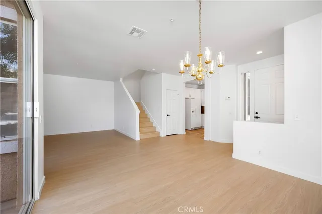 a view of a chandelier in an empty room