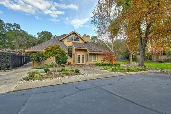 a front view of a house with garden