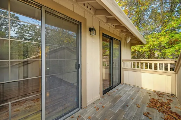 a view of a house with a wooden deck