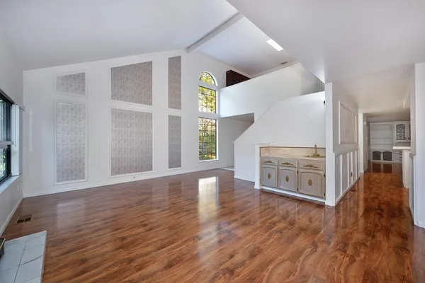 a view of a livingroom with wooden floor