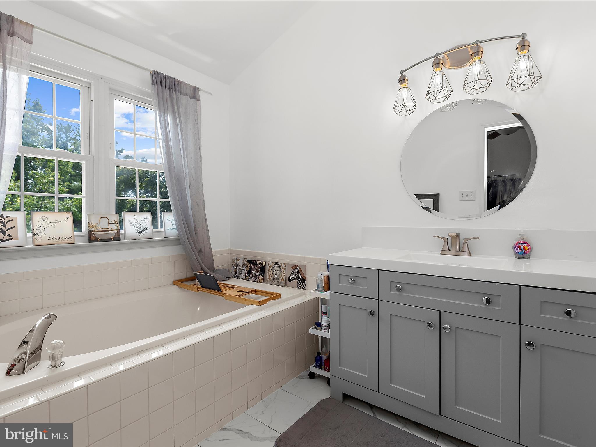 930 Mosby Drive Frederick, MD 21701 - Photo 33 of 52 a bathroom with a tub sink and mirror