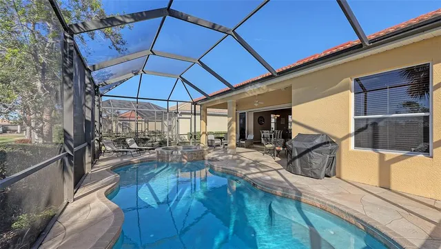 a view of a house with a backyard porch and sitting area