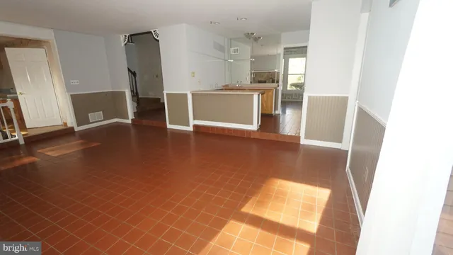 a view of kitchen with furniture and wooden floor