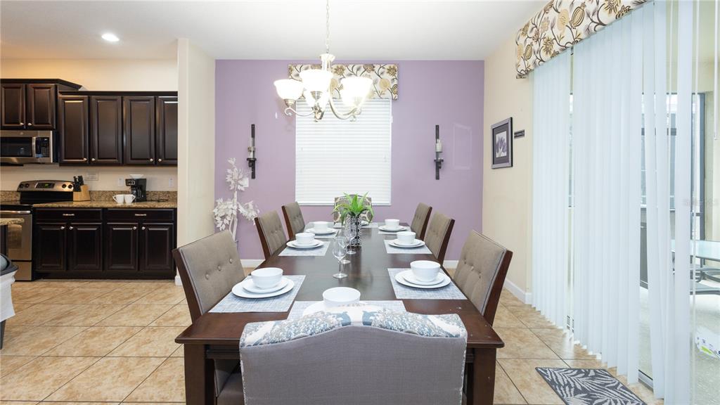 2977 Buccaneer Palm Road Kissimmee, FL 34747 - Photo 12 of 66 a view of a dining room with furniture