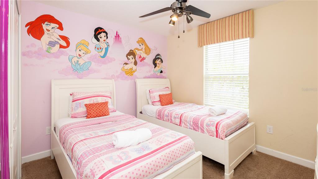 2977 Buccaneer Palm Road Kissimmee, FL 34747 - Photo 22 of 66 a bedroom with two beds and a window