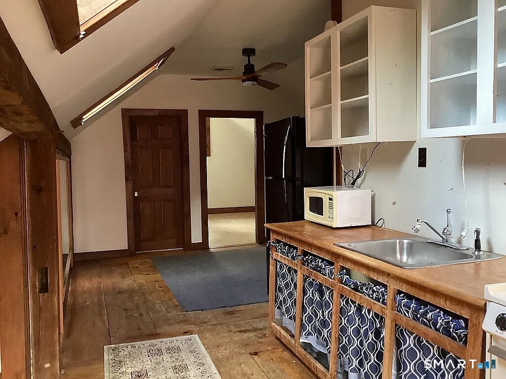 2581 Litchfield Road Watertown, CT 06795 - Photo 18 of 26 a kitchen with stainless steel appliances granite countertop a sink and cabinets