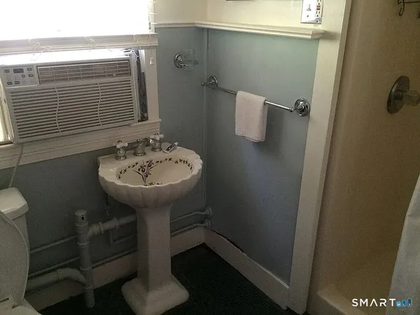 a room with window and furniture