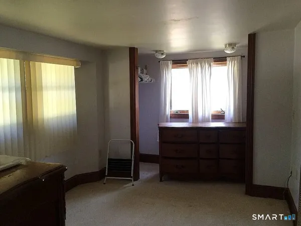 a kitchen with stainless steel appliances granite countertop a stove refrigerator and cabinets