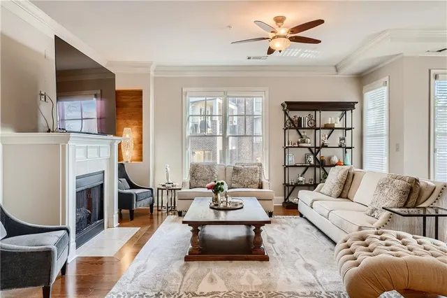 a living room with furniture and a fireplace