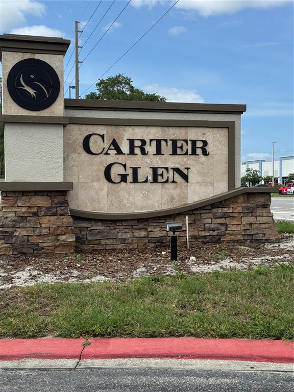 a view of a sign in front of house