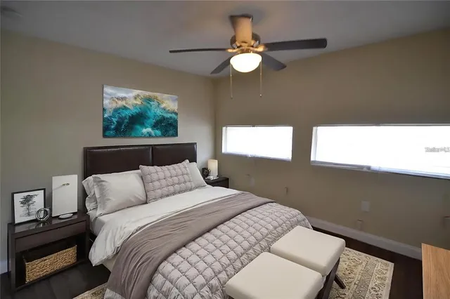 a bathroom with a granite countertop sink a mirror and a shower
