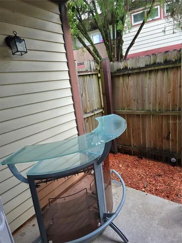 a balcony with table and chairs