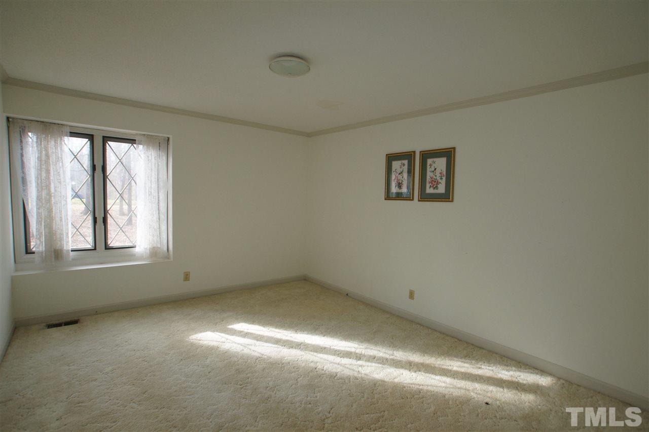6901 Lake Wheeler Road Raleigh, NC 27603 - Photo 14 of 22 an empty room with a empty space and windows