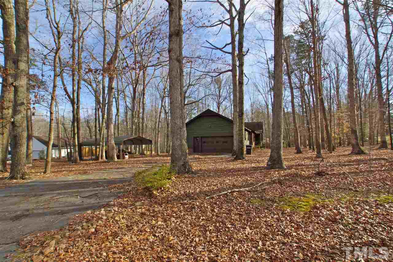6901 Lake Wheeler Road Raleigh, NC 27603 - Photo 3 of 22 a view of a backyard with large trees