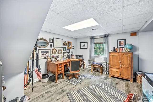 a view of a workspace with furniture and a workspace