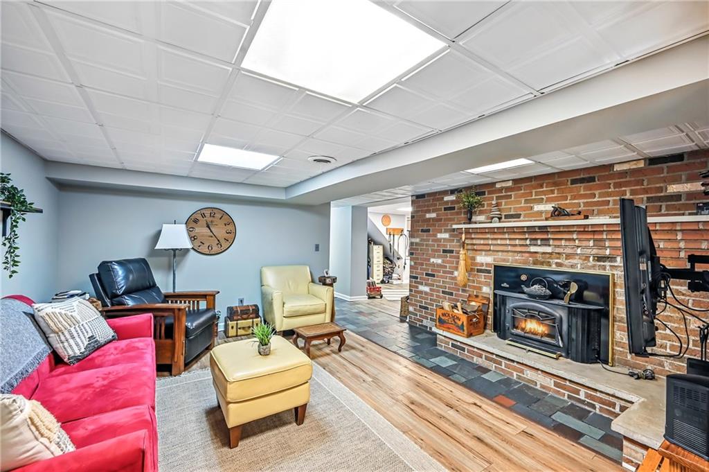 78 Folk Road Fredonia, PA 16124 - Photo 33 of 50 Beautiful family room with wood stove; opens to the plant room/ exercise room.