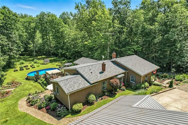 an aerial view of a house with a garden