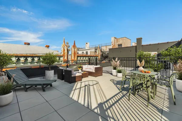 a living room with patio furniture and a window